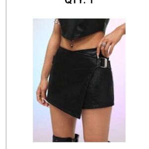 Asymmetrical leather skirt with buckle